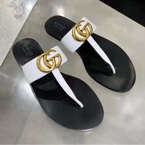 Gucci Women's Black and White Sandals with Gold Accents